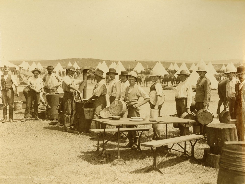 Dinner time, camp of Bushmen's contingent at Kensington, c.1900. Digital ID1254_a011_a011000006r  Dinner time, camp of Bushmen's contingent at Kensington, c.1900. Digital ID1254_a011_a011000006r