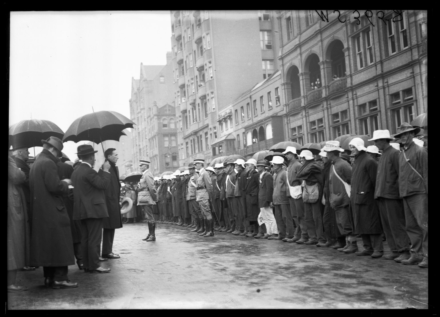 Premier Holman (under umbrella) addresses the Waratahs, Macquarie Street, Sydney, 17 December 1915. NRS 4481, MS3658 Premier Holman (under umbrella) addresses the Waratahs, Macquarie Street, Sydney, 17 December 1915. NRS 4481, MS3658