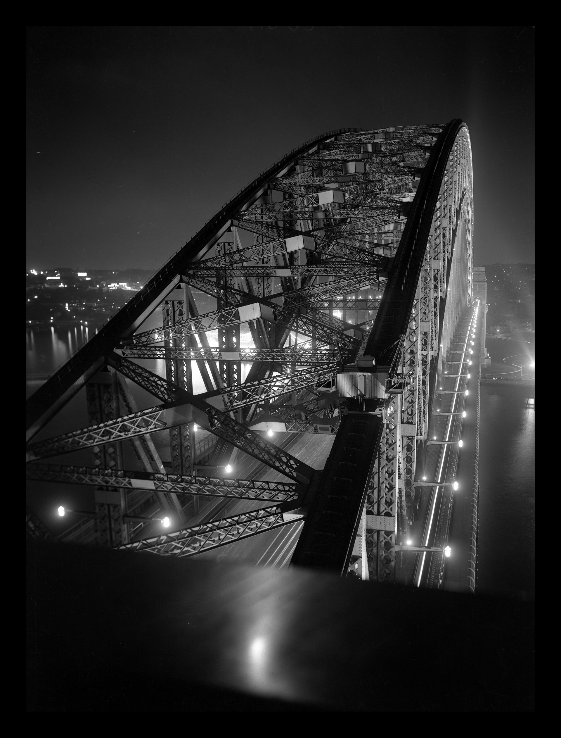 Sydney Harbour Bridge c.1938 - Sesquicentennial floodlighting, view from south pylon. NRS-21243-2-3-1347