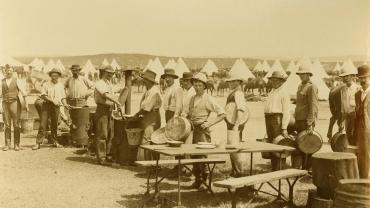 Dinner time, camp of Bushmen's contingent at Kensington, c.1900. Digital ID1254_a011_a011000006r 