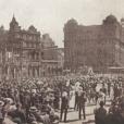 Crowds watching the eight-hour day procession passing St Andrews, Town Hall and the QVB before heading up Park Street, Sydney, 1915. NRS 20499 